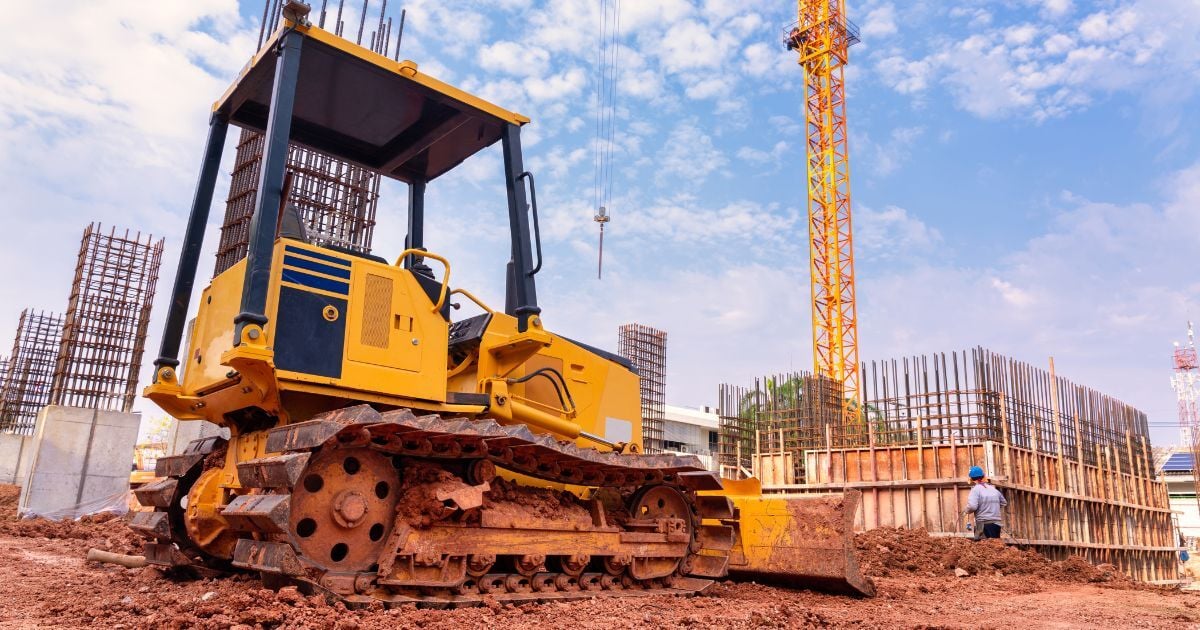 Construction site with plant and machinery, illustrating holding companies and group structures for UK construction businesses