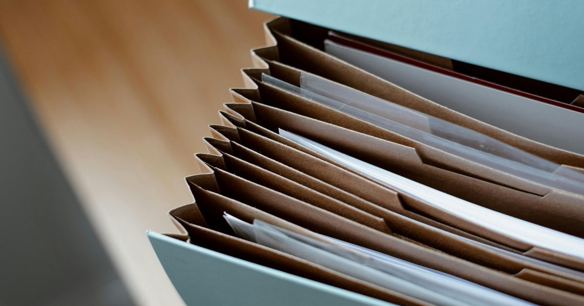 Business owner preparing financial records in an online data room for due diligence when selling a business