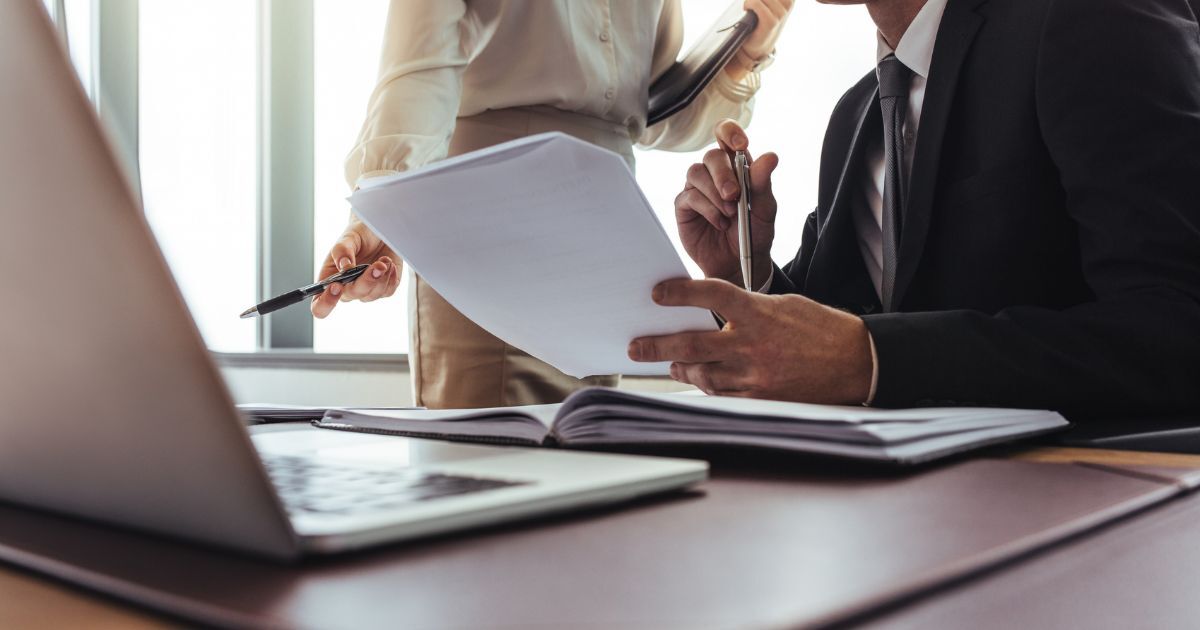 Business owner reviewing the tax on selling a business in the UK with an accountant